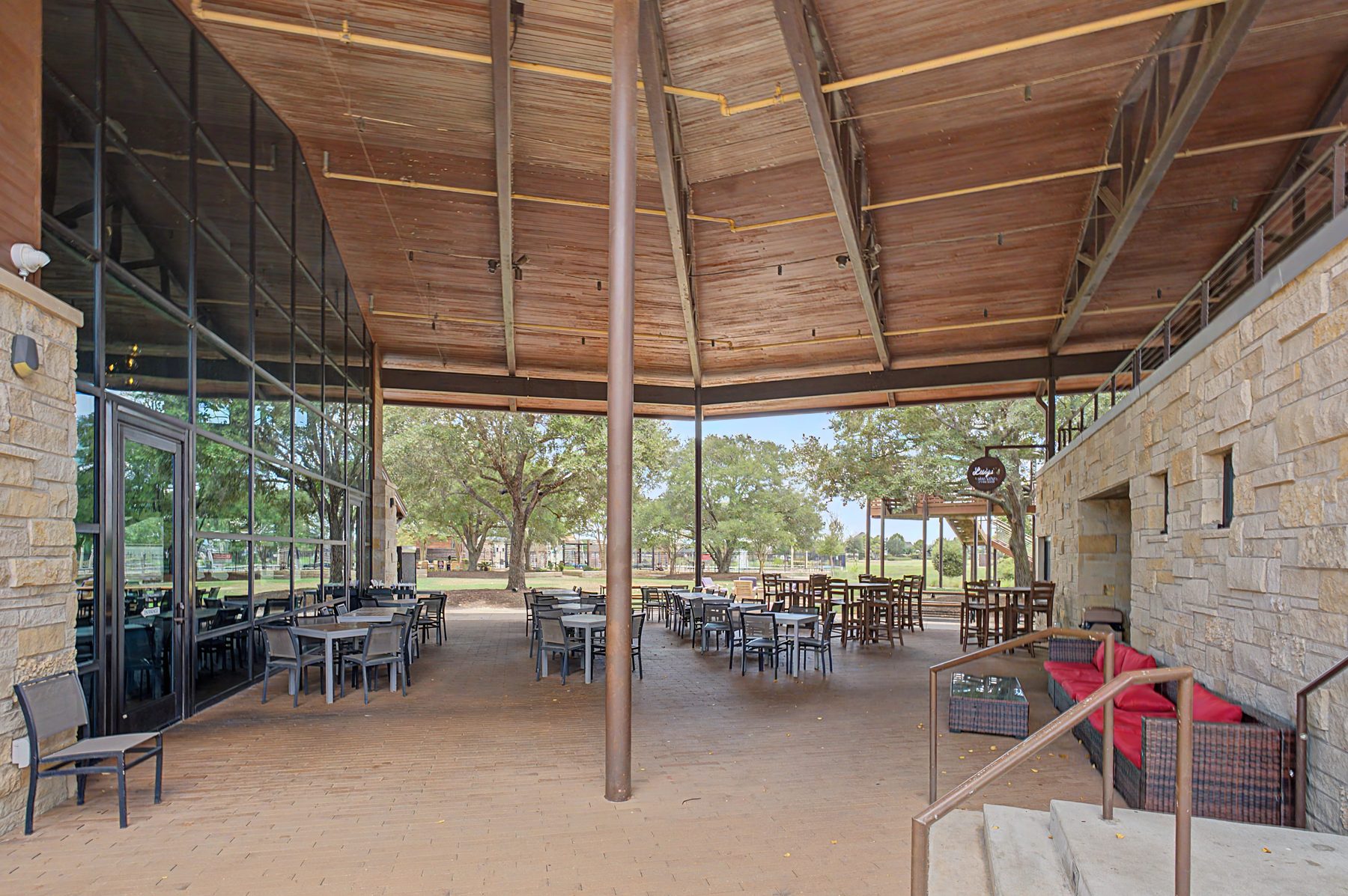 Stone and cedar exterior of Texas Borders Bar and Grill in Cane Island, Katy