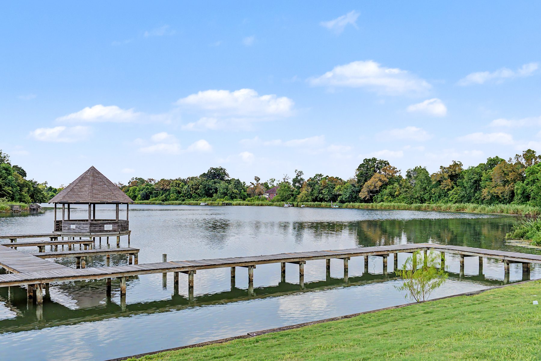 Fishing piers and gazebo on the lake at Lake Olympia, Missouri City TX